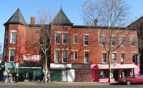 Built originally as a large three-story house, the property was later partially converted to retail use, and modified with various unfortunate accretions and deletions over the years. Most alarmingly, the supporting masonry base for the central bay had been removed. Historic building existing conditions