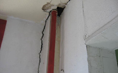 Typical of many DC rowhouses from this era, the existing footings were inadequate to support building loads. The crack shown here, caused by settlement, ran from roof to foundation. Structural crack