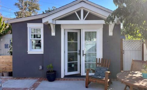 The ADU shares a patio seating area with the main house. Photo of garage conversion ADU in San Luis Obispo