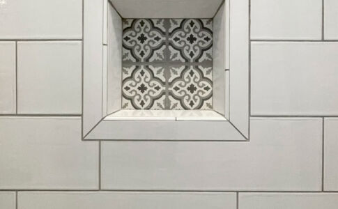 Custom tile niche detailing. Photo of custom tile shower niche at garage conversion ADU