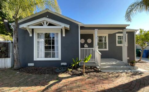 Craftsman-style detailing was added to the main front window, with similar detailing at the new side-yard entry vestibule. Photo of remodeled house in SLO