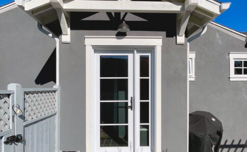 The new side entry gives direct access to outdoor dining at the side yard, as well as to the new ADU out back. Photo of new entry vestibule addition