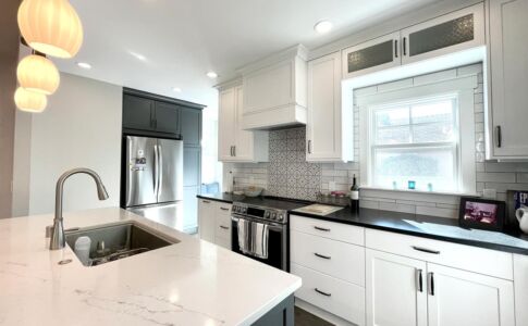 Compared to its predecessor, the new kitchen features an abundance of storage space -- including a full-height pantry cabinet next to the refrigerator. Photo of remodeled kitchen