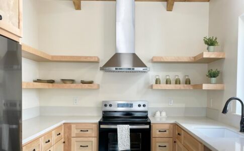 A sleek, minimalist kitchen in natural tones exudes serenity in this newly-constructed ADU. Closeup of Kitchen